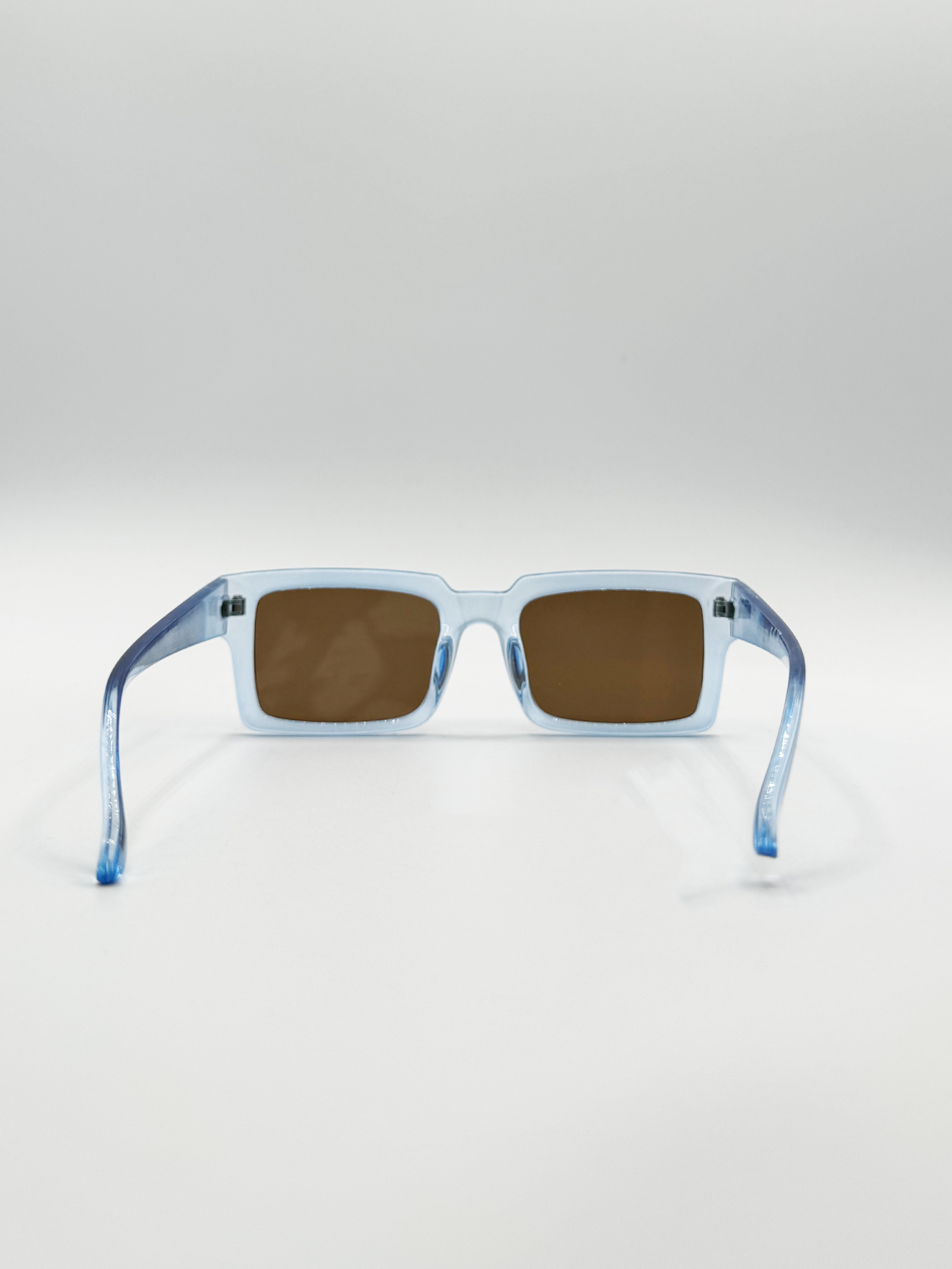Square Frame Sunglasses in Translucent Blue with Brown Lenses