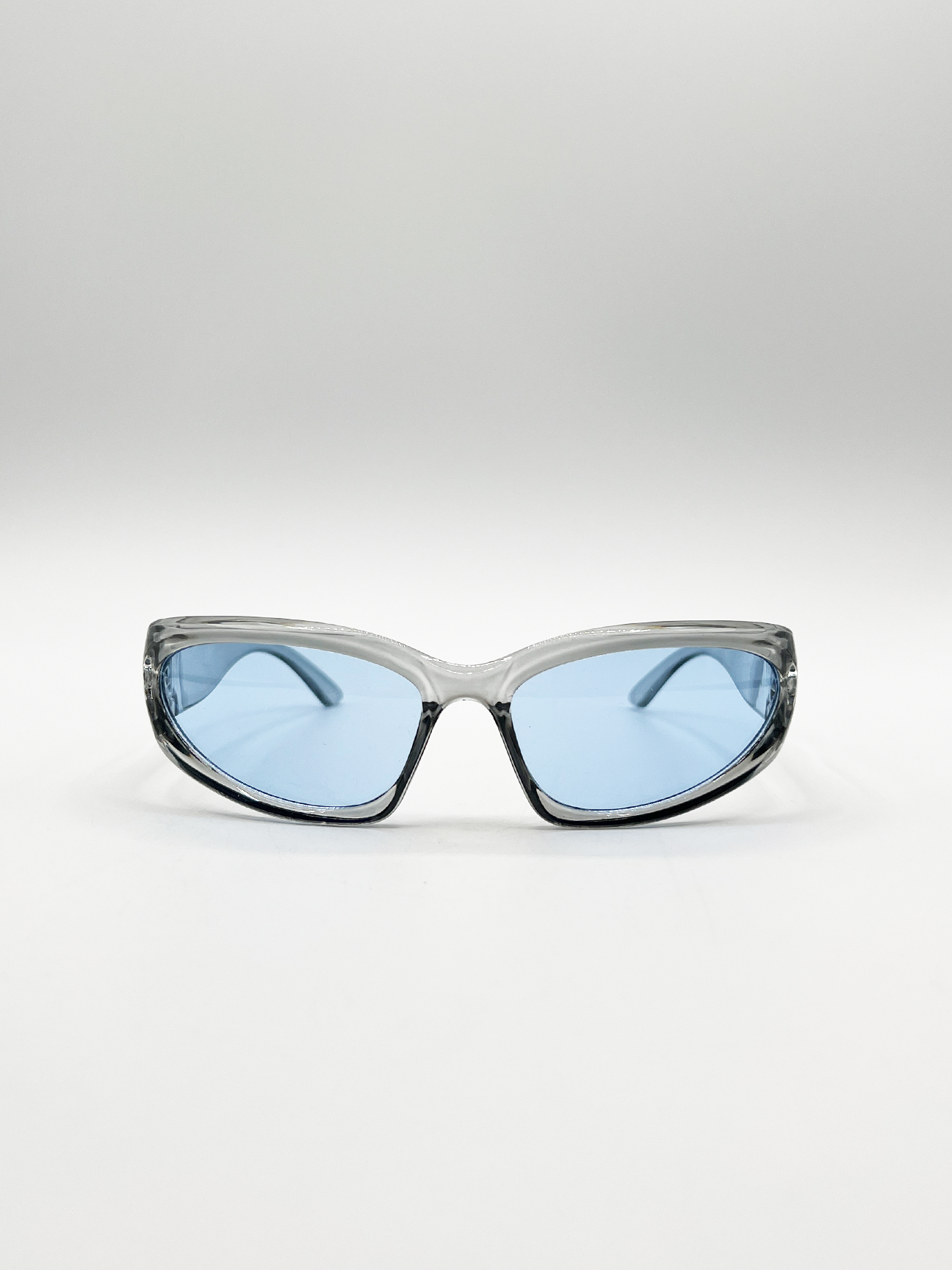 Wrap Around Racer Sunglasses in Translucent Blue